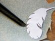 Le coussin motif plumes