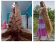 Cette russe a des cheveux incroyablement longs… et en plus ils sont brillants !