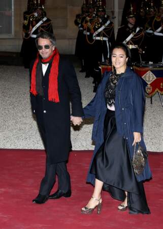 Jean-Michel Jarre et sa compagne Gong Li à l'Élysée le 25 mars