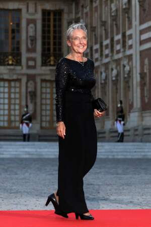 Visite de Charles III : Elisabeth Borne dans une robe longue noire avec haut tout en sequins