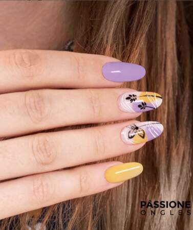 Un nail art papillon violet et jaune
