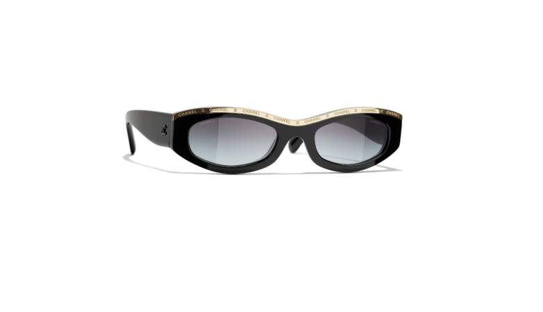 Les lunettes ovales en acétate noir et or 